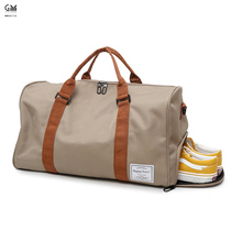 GM trendy Oxford cloth travel bag womens large-capacity business trip short-distance gift bag mens portable belt shoes warehouse tide