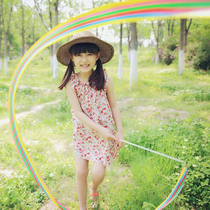 Stepping Spring Outscene Children Write Real Photo Photo Photography Hand Holding Props Colorful Silk Ribbon Dance Performance Street Photo Composition