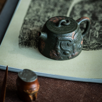 Handmade Yixing purple sand pot Bionic pot Animal face bronze bell pot Small and medium capacity section mud powder green clay national tide