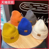 Hat female autumn winter wool hat Korean version of tide Joker leather label bag sleeve cold hat warm ear protection British knitted hat