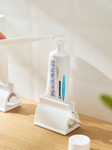 Yika home home creative toothpaste holder facial cleanser manual labor-saving lazy squeezing toothpaste artifact