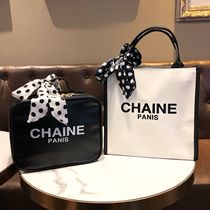 Small fragrant wind ribbon with makeup bag portable letter round point silk scarf butterfly knot handbag Europe and America large capacity containing bag