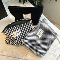 High face value makeup bag women 2021 new advanced senses large capacity portable carry-on black and white grunge containing wash bag