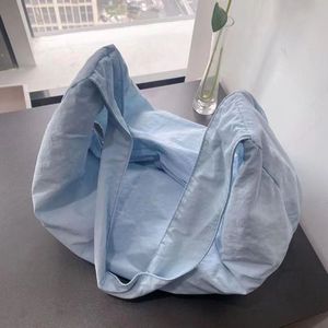 夏天帆布饺子包慵懒风2023新款小众设计女包纯色百搭出游休闲包包