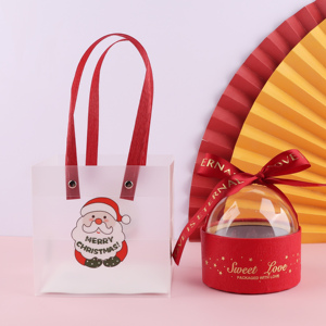 圣诞慕斯球手提袋子 圣诞老人抱抱桶慕斯球蛋糕包装袋透明手提袋