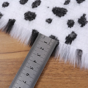 仿兽黑白斑点豹纹毛绒布料人造毛皮草服装面料背景布地毯垫布