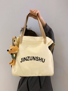 日本帆布包斜挎大容量日系单肩包女高中学生手提布包包拎书袋