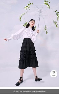 太平鸟黑色半身裙女蛋糕裙时尚设计感夏季新款休闲A字裙长裙