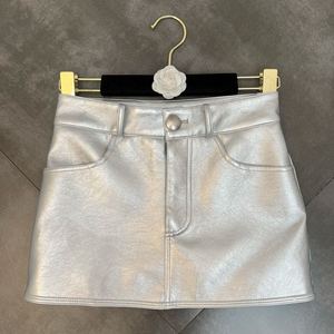 柚子MM2022年夏季一粒扣口袋装饰金属色哑光pu欧美ins风包臀半裙
