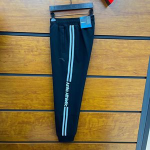 安踏男裤2022春新款黑色字母针织系带运动休闲长裤束脚152217326