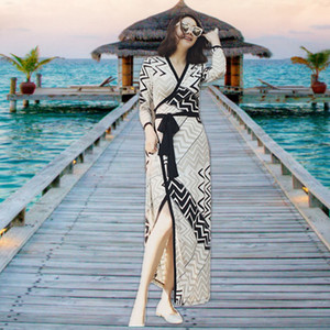 海边度假沙滩裙显瘦裹身裙波西米亚海滩长裙v领长袖连衣裙女秋装