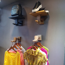 Clothing store hook display rack on the wall is hanging shoe bag shelf Womens clothing hanging clothes shelf Childrens clothing store shelf