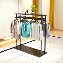 Double row island rack landing womens store middle display shelf Gold parallel bar display clothes rack Childrens clothing is hanging