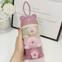 Large capacity four-layer milk powder box portable baby milk powder grid baby out independent sealed auxiliary food box moisture-proof storage