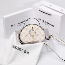 Hong Kong leather small round bag 2021 new fashion high-grade sense of one shoulder messenger bag Western style handbag summer