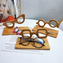 Creative glasses shop counter Zhongdao display props placement rack new sun glasses bamboo glasses display stand