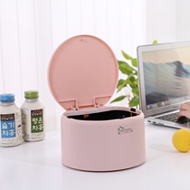 Small trash can on the practical coffee table on the desktop table of the mini student bed in the living room phone