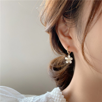 Korean cats eye stone flower earrings female senior sense light luxury 2021 New Tide temperament goddess fan sterling silver earrings