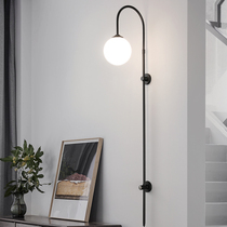 Nordic simple living room bedroom bedside designer creative long pole wall lamp gold and black matte double-layer cover free wiring