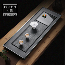 The whole piece of natural black gold stone tea tray household drainage dry and wet tea sea light luxury modern simple tea table small tray