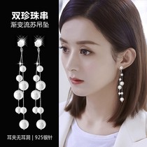 Pearl Streaming Suear Clip Woman Without Earrings Earrings 2021 New Tide round face pendant lukewarm with a little high level of senior
