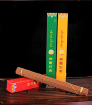 (Kinsa Store) The long square box of the incense is removed from the barrier for the Buddha.