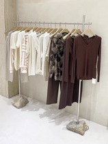 Womens clothing stores dedicated brushed stainless steel display the bending floor stone shelf island display rack