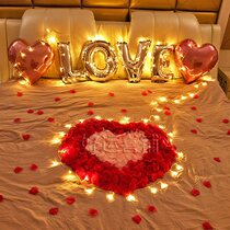 Male and female friends make romantic surprise confession proposal rose petal hotel bed room balloon arrangement Valentines Day