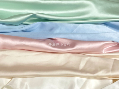 taobao agent Ice cream satin high -definition luster dresses fabric solid color soft wrinkle designer cloth skirt