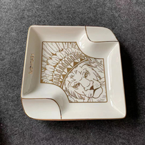 Rubinsky trademark LOGO lion head like a cigar duo in an ashtray
