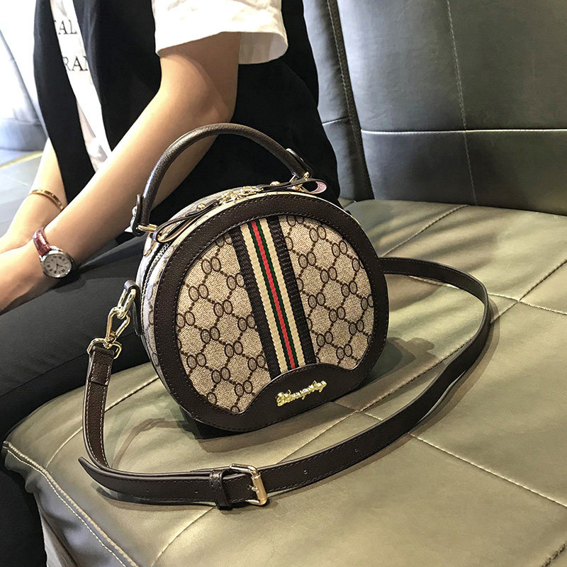 Hong Kong round brand bag womens bag 2021 new fashion sloping hand-held small round bag bag