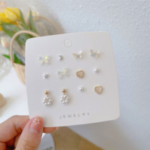 S925 silver pin bow stud earring set female Xia minority design sense Cats Eye Stone simple student raising ear earrings