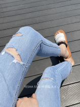 5566 Ye Sha European station 2021 summer new European goods high waist ripped nine-point jeans slim-fit small pants women
