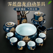 Inlaid with gold blue and white porcelain ceramic lazy automatic Kung Fu tea set Stone mill tea pot complete set of household Jianzhan tea ceremony set