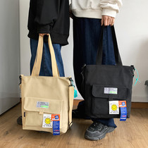 Korean men and women Hand bag Tide brand large capacity canvas bag Japanese wild students class shoulder bag shoulder bag female