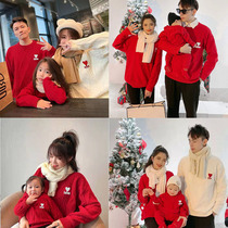 In the Year of the Tiger a family of three and four mothers and daughters a family portrait red love knitwear sweaters New Year's Eve clothing