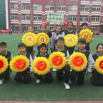 Opening of the Games holding flowers red flag sunflowers smiley face sunflower chorus red song props