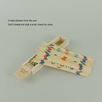 The bald chicken is bored play with him a childhood toy a wooden pick stick to decompress nostalgic toys