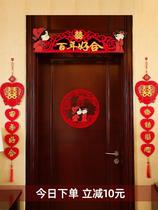 The wedding room is arranged in the whole house. The man prepares the wedding supplies and the decoration on the door.