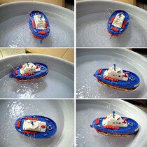 Electric water spray fire boat toy water toy boat childrens educational toy boy warship ship model plastic