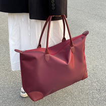 Waterproof travel large capacity travel bag yoga fitness bag bag female hands proposed to poor students to dress large bag