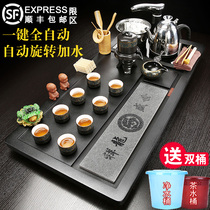 A complete set of tea sets household living room automatic tea tray solid wood tea table large induction cooker one light luxury tea sea