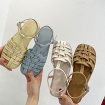  Woven semi-baotou sandals fairy 2021 summer new one-word buckle belt student flat-bottomed beach Roman cool drag