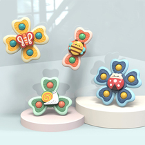 Infant fingertip gripping turning-over-the-finger top bath coaxing the Gods will turn the babys puzzle toy