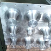 Fan curvilinear nozzle flow nozzle plate combination device