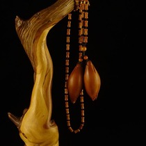Pure hand carving "Magnolia" Xu Shi nuclear carving Zhoushan olive walnut carving necklace hanging neck writing collection