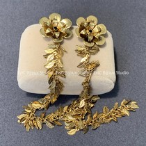 Big designer 24k gilded waterfall tassel leaf earrings