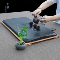 Dongyun whole black gold stone tea tray Retro stone tea table Small stone tea sea stone carving black stone drainage tea stand