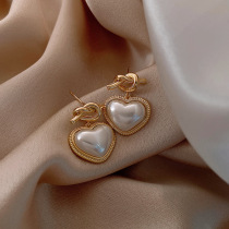 Pearl love knotted earrings female temperament Korean Joker Net red heart shaped earrings earrings studs 2020 New Tide