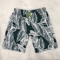 Quick-drying loose beach pants male hot spring large size seaside vacation couple outfit five-point swimming trunks suit flower shorts male